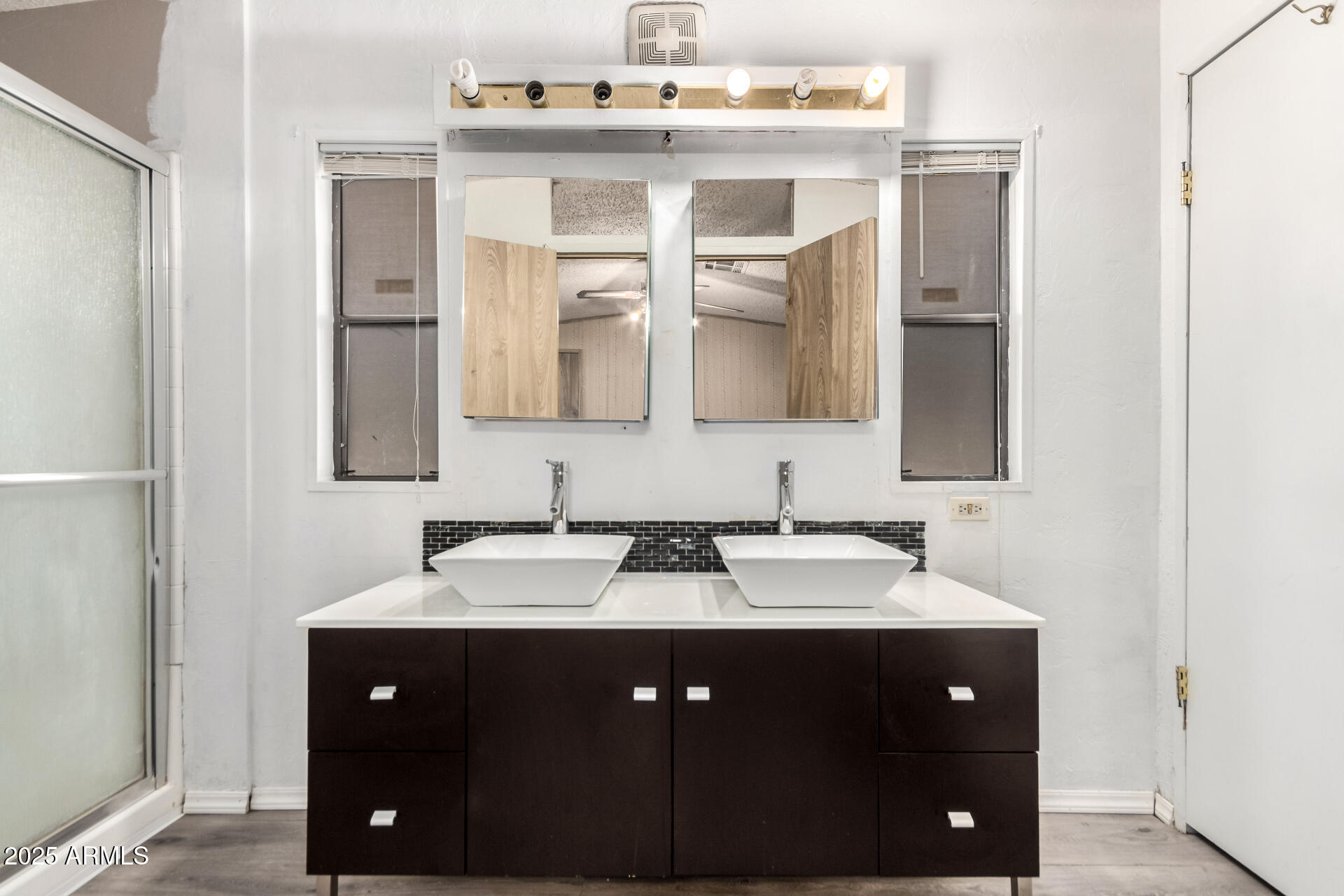 834 South Meridian Road, Unit 116 Apache Junction, AZ 85120 - Photo 19 of 42 a bathroom with a sink vanity and mirror