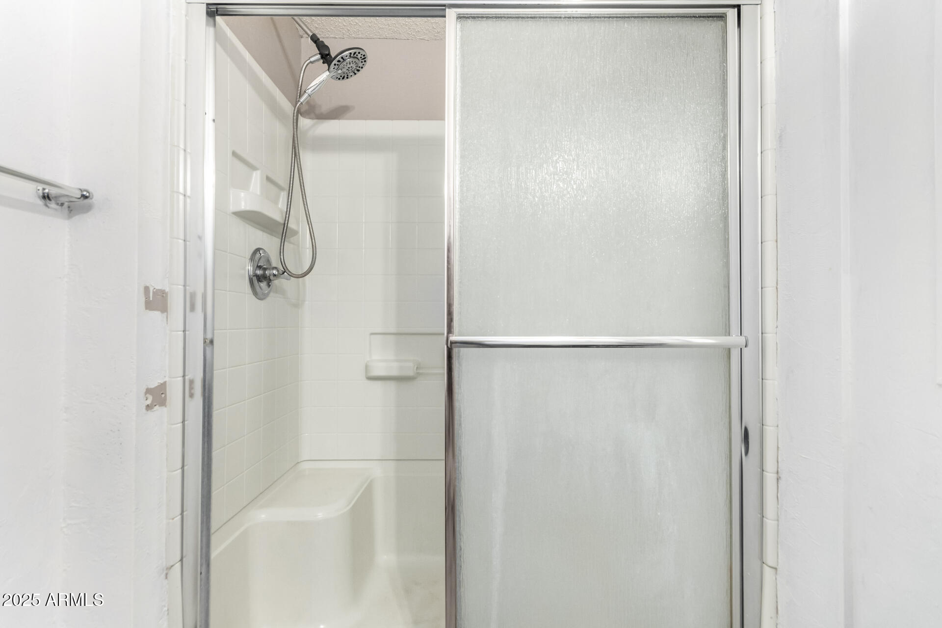 834 South Meridian Road, Unit 116 Apache Junction, AZ 85120 - Photo 20 of 42 a bathroom with a glass shower door