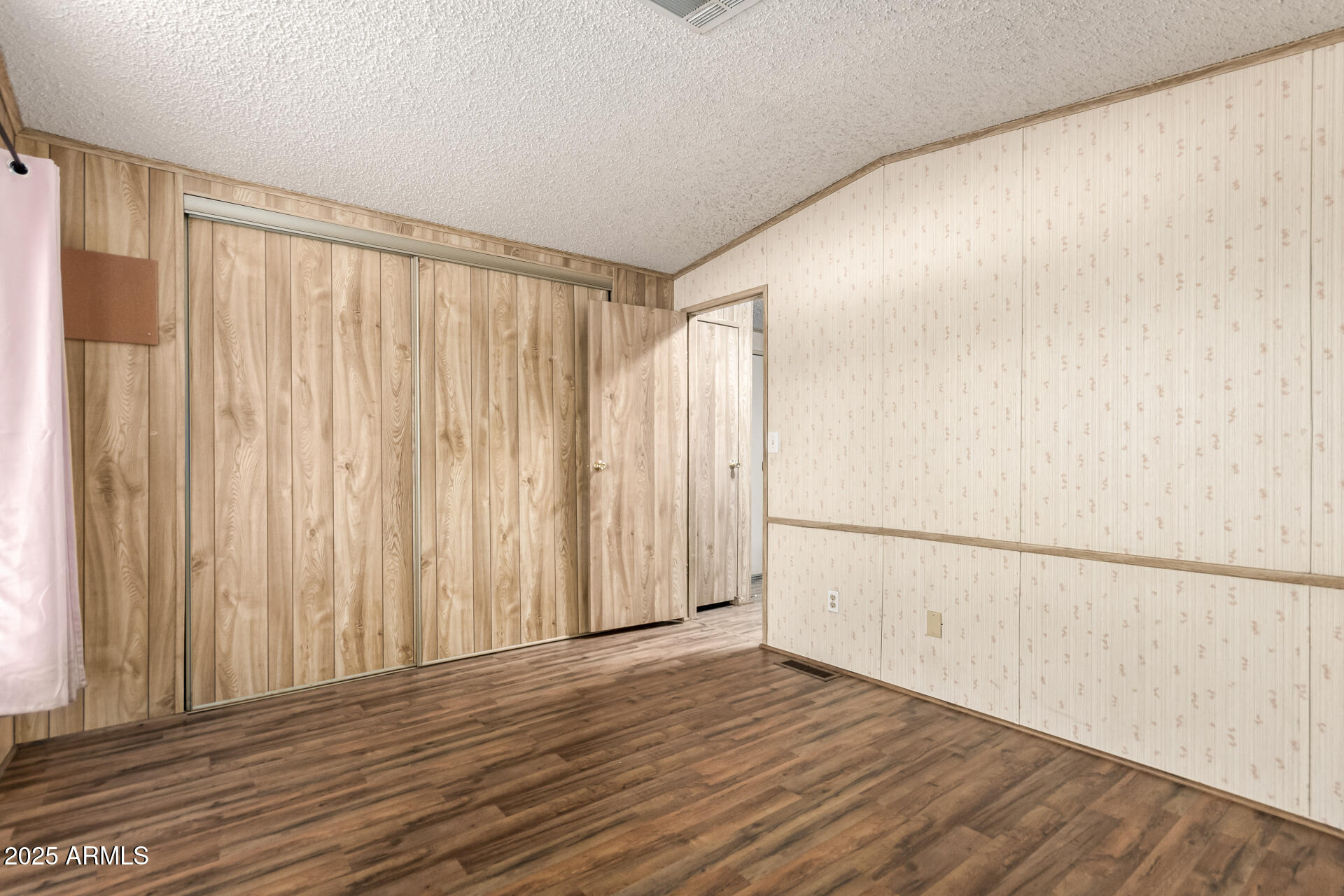 834 South Meridian Road, Unit 116 Apache Junction, AZ 85120 - Photo 23 of 42 a view of a room with wooden floor and walls