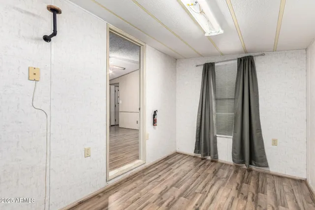 a view of cabinets with wooden floor