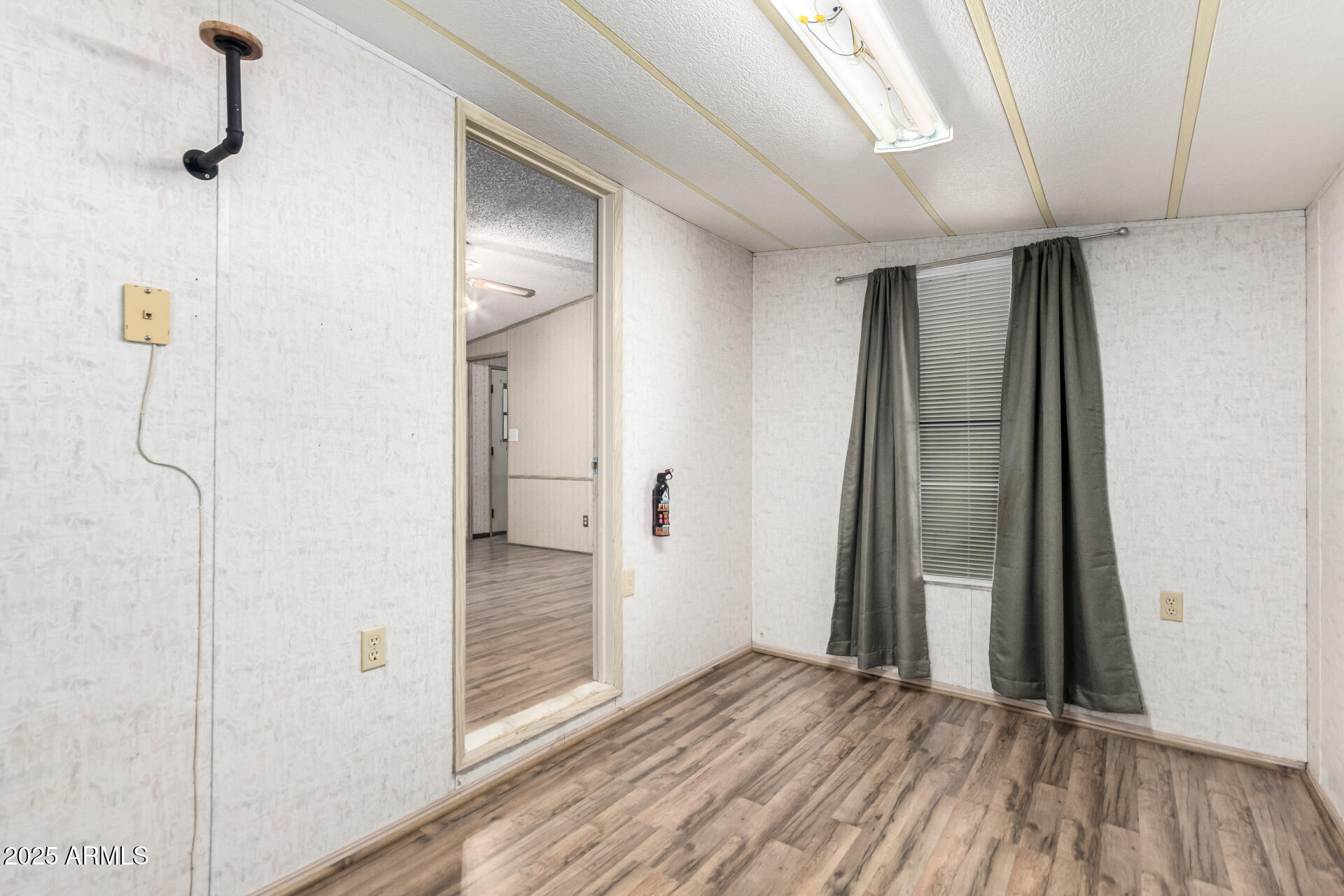 834 South Meridian Road, Unit 116 Apache Junction, AZ 85120 - Photo 26 of 42 a view of a hallway with wooden floor and staircase