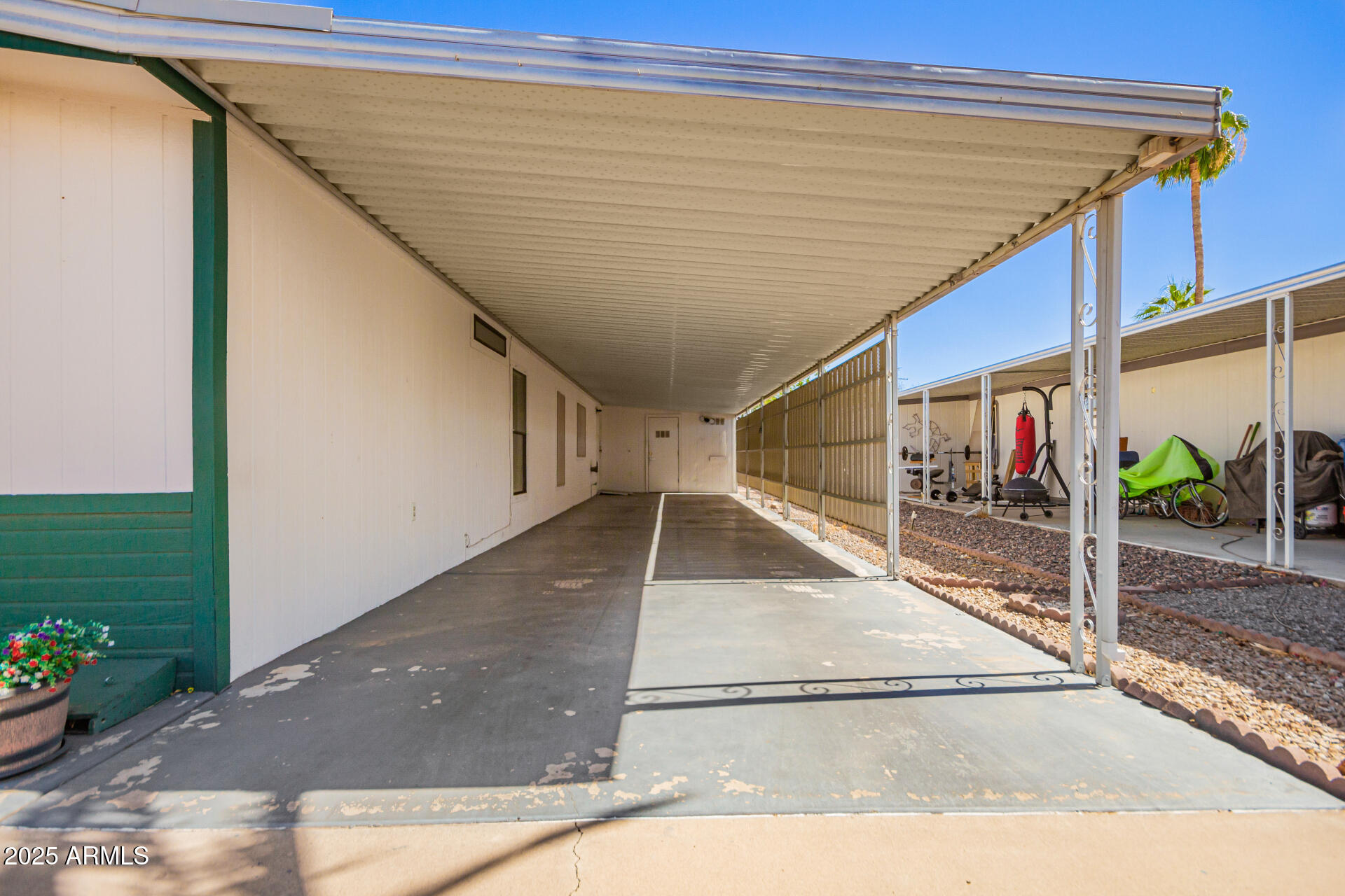 834 South Meridian Road, Unit 116 Apache Junction, AZ 85120 - Photo 28 of 42 a view of a house with a backyard