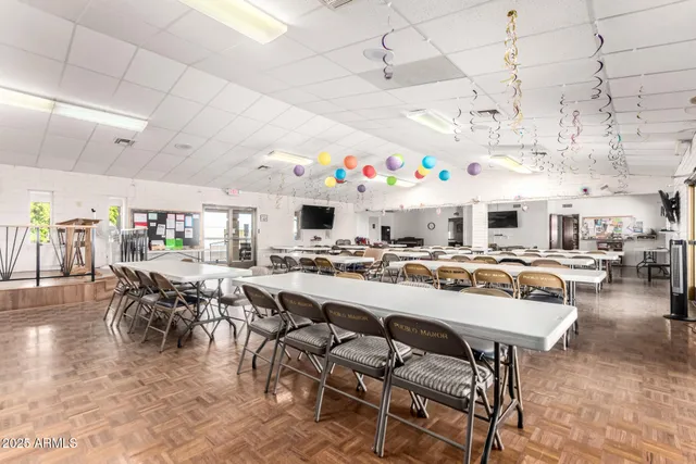a group of people sitting at tables in a room