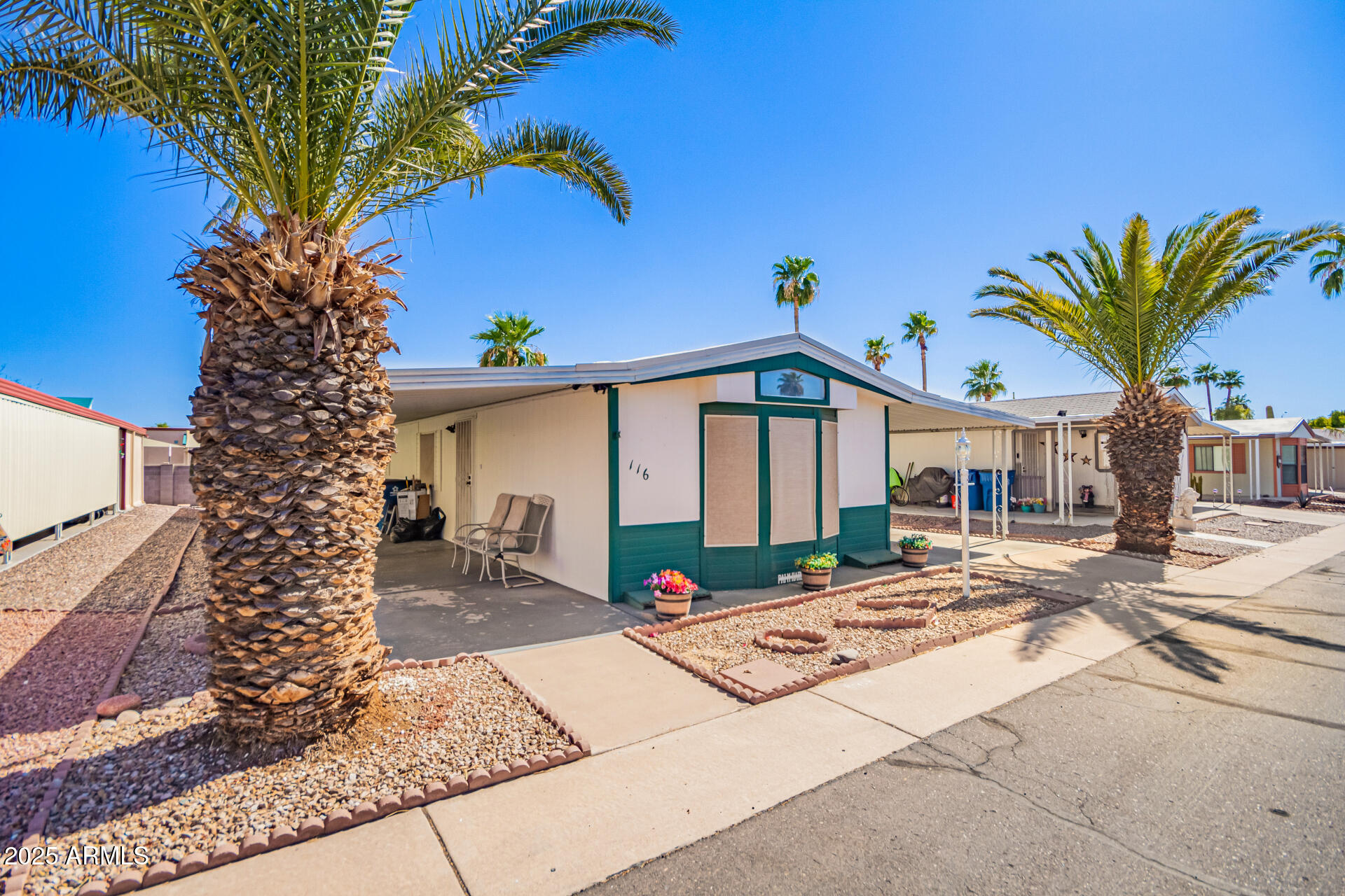 834 South Meridian Road, Unit 116 Apache Junction, AZ 85120 - Photo 3 of 42 a view of a house with a patio