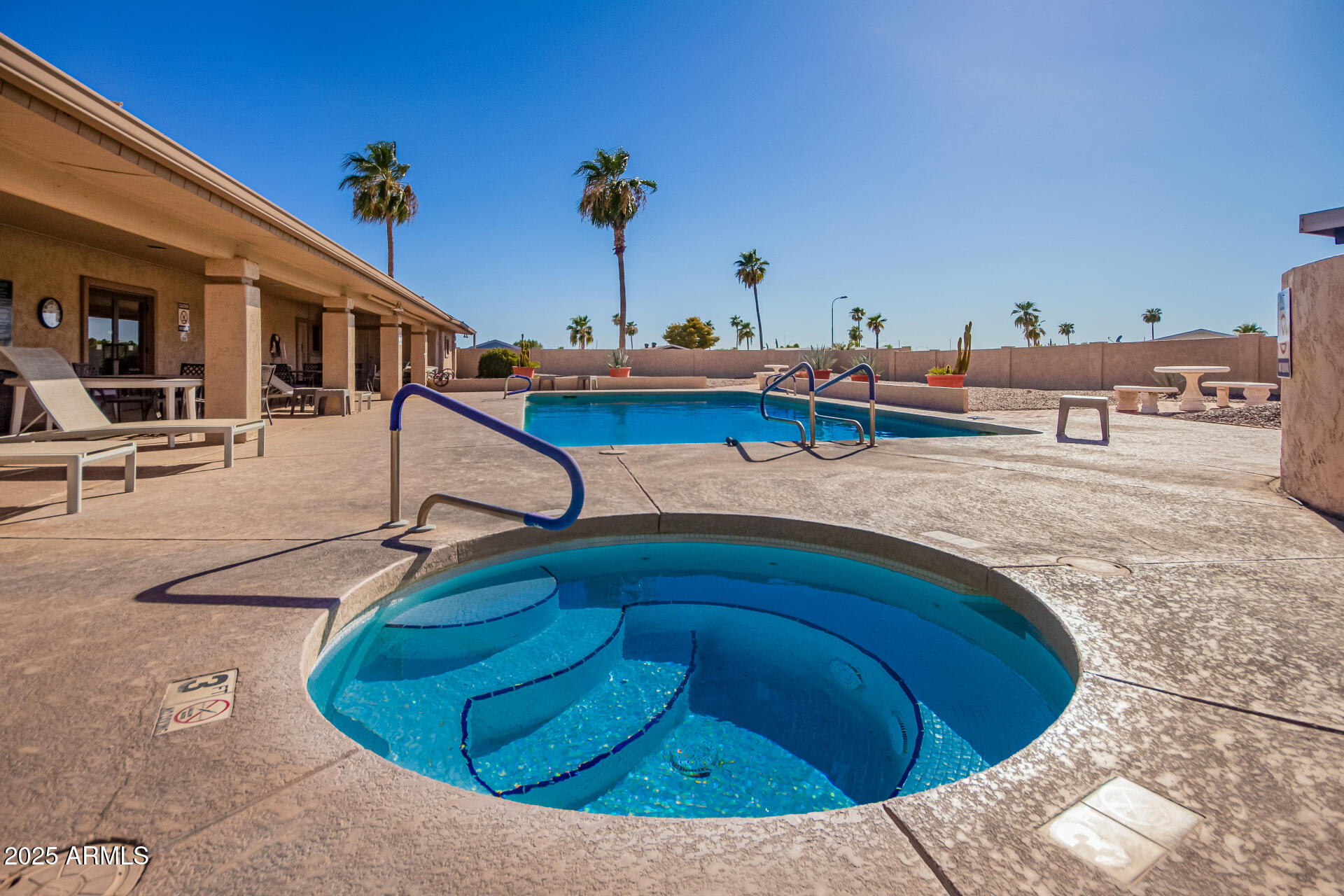 834 South Meridian Road, Unit 116 Apache Junction, AZ 85120 - Photo 39 of 42 a swimming pool with outdoor seating