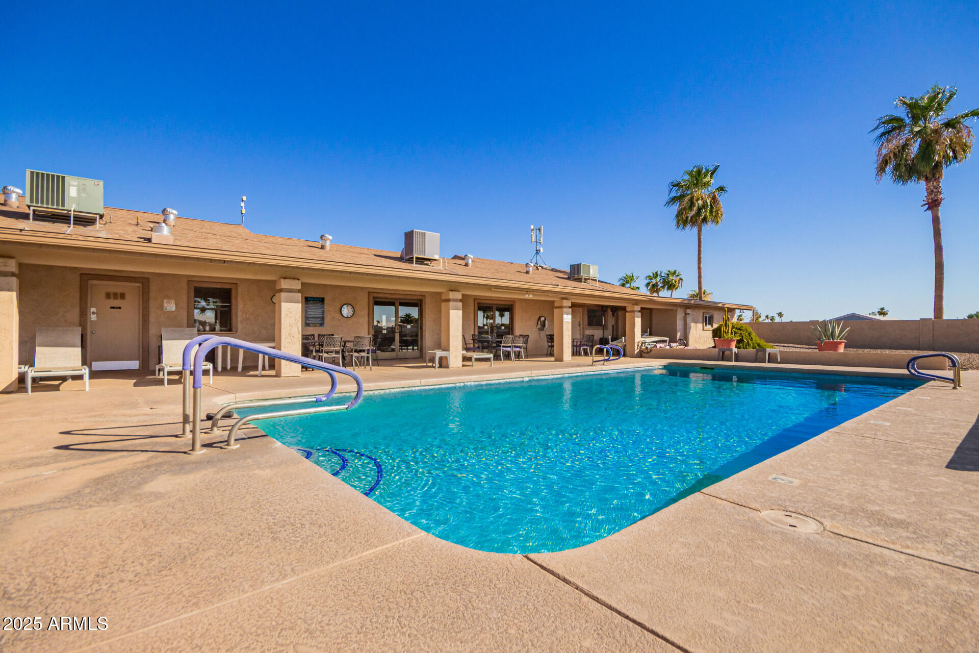 834 South Meridian Road, Unit 116 Apache Junction, AZ 85120 - Photo 42 of 42 a front view of a house with swimming pool