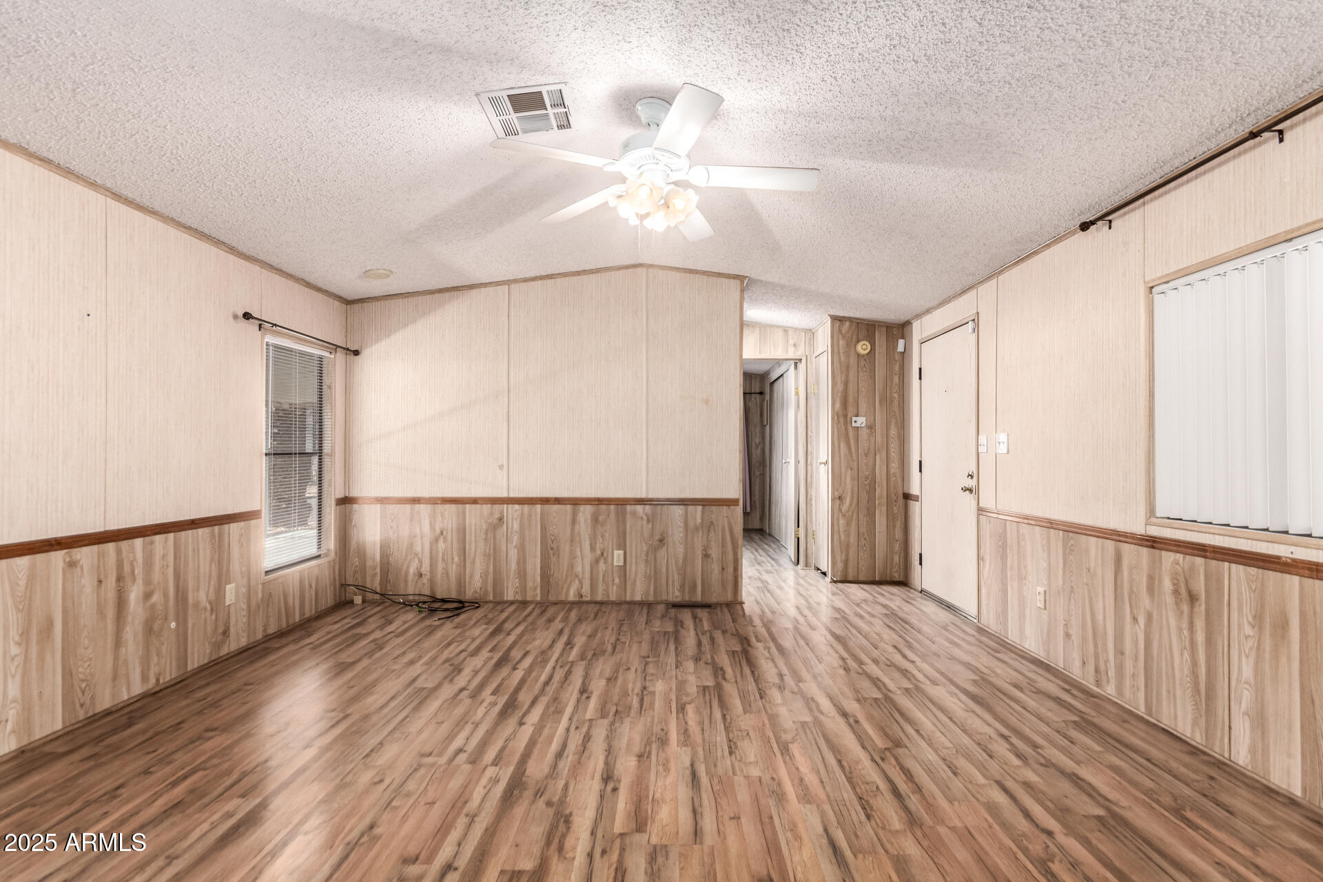 834 South Meridian Road, Unit 116 Apache Junction, AZ 85120 - Photo 10 of 42 a view of a hallway with wooden floor