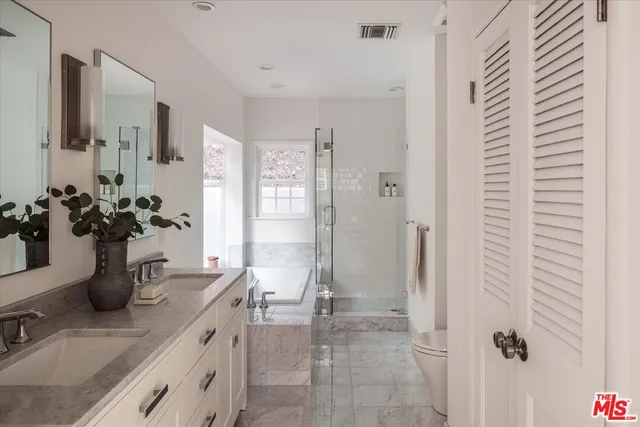 a bathroom with a tub and shower