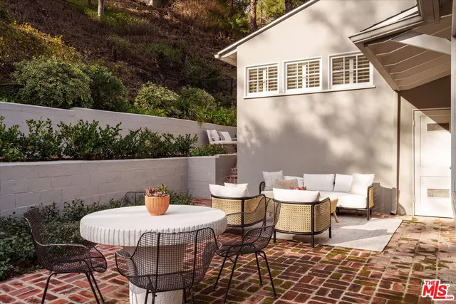a outdoor space with chairs and wooden floor