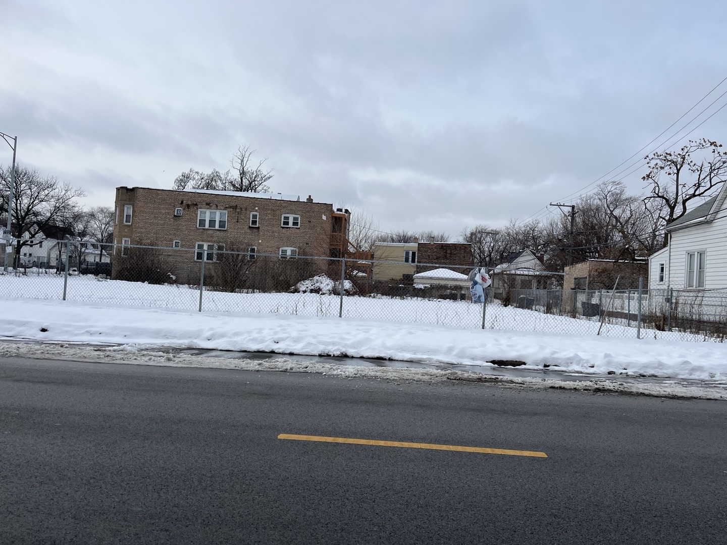 1000 West Marquette Road Chicago, IL 60621 - Photo 2 of 2 a view of a building with a snow on the road