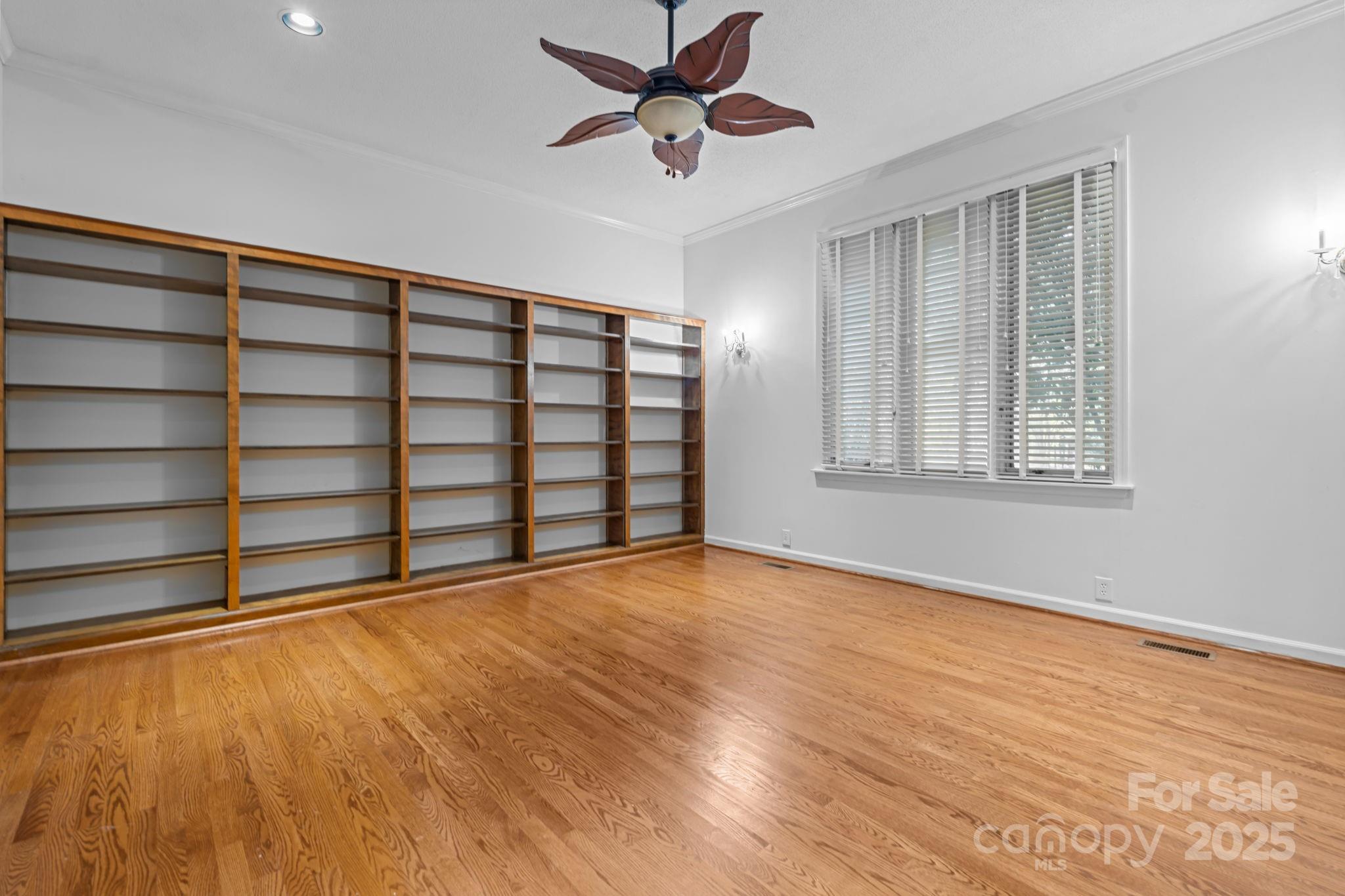 2000 Airport Road Carthage, NC 28327 - Photo 14 of 45 a view of an empty room with a window and wooden floor