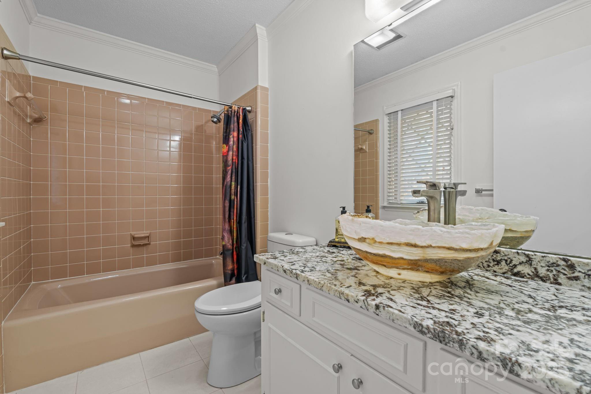 2000 Airport Road Carthage, NC 28327 - Photo 23 of 45 a bathroom with a granite countertop sink toilet mirror and bathtub