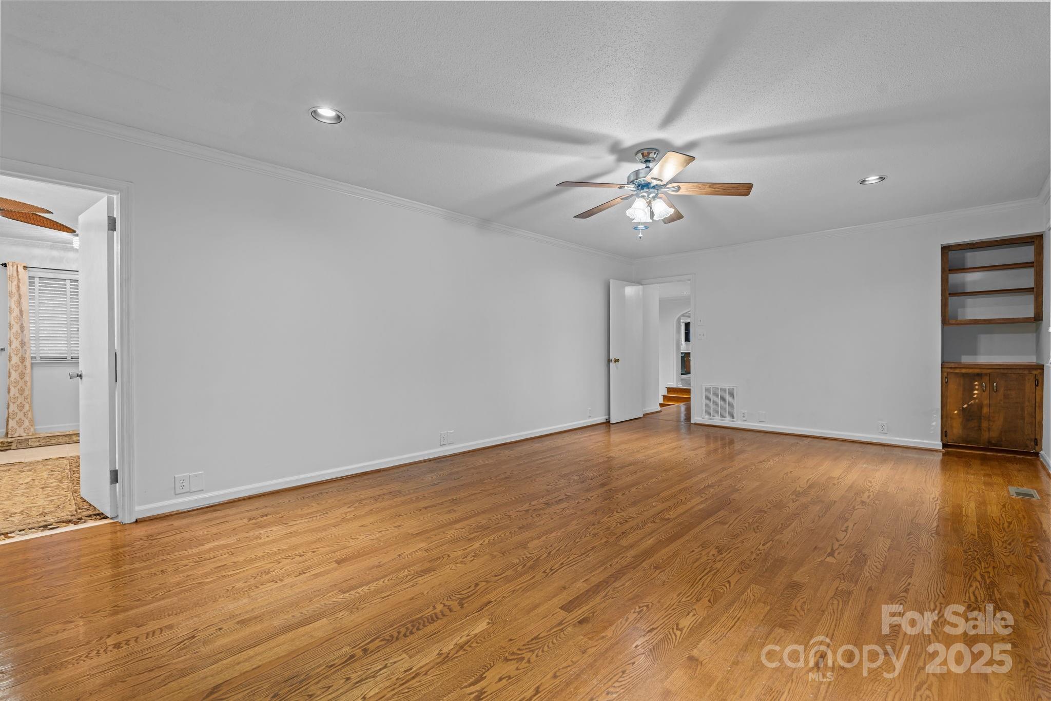 2000 Airport Road Carthage, NC 28327 - Photo 28 of 45 a view of a room with wooden floor and a ceiling fan