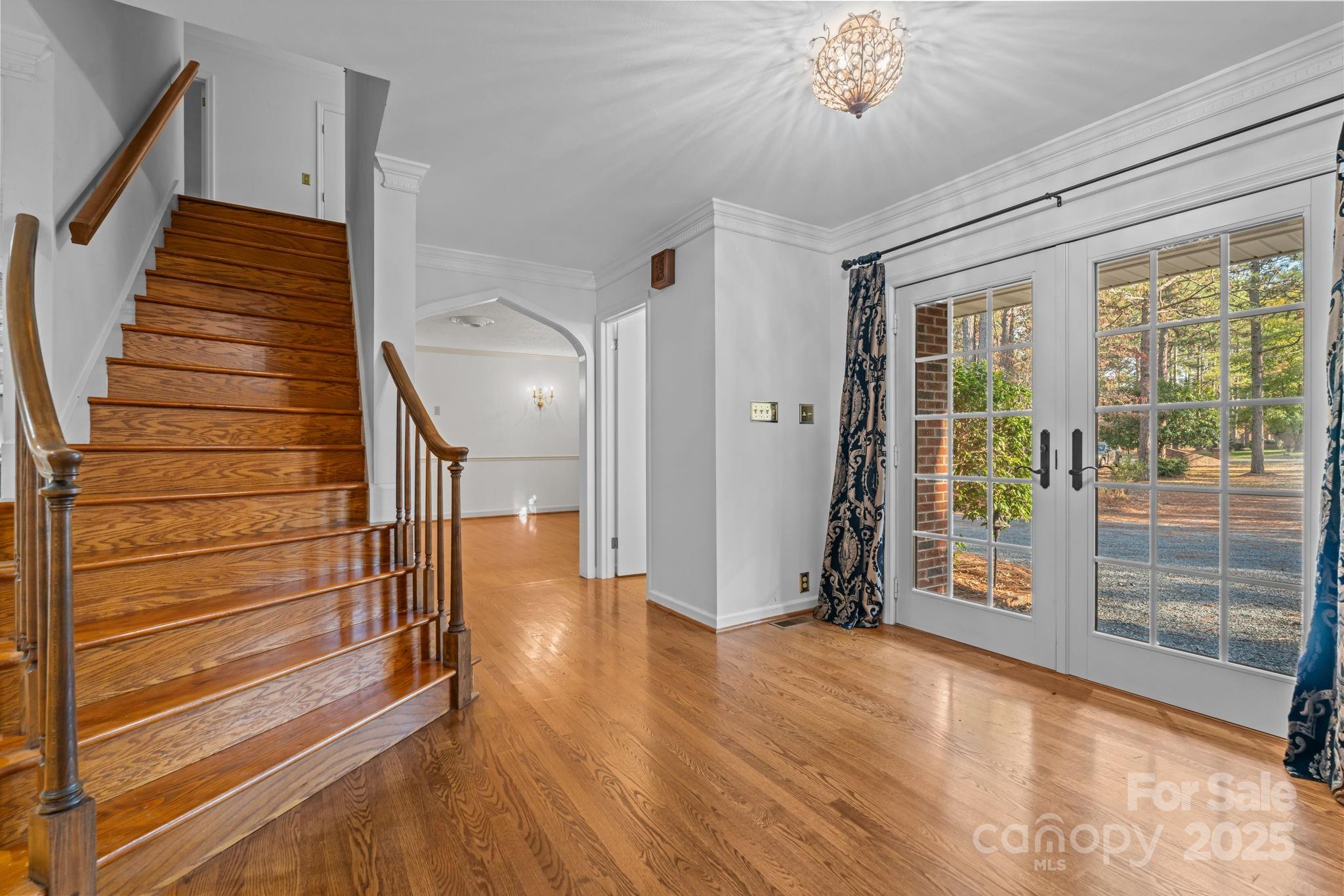 2000 Airport Road Carthage, NC 28327 - Photo 29 of 45 a view of a hallway with wooden floor and staircase
