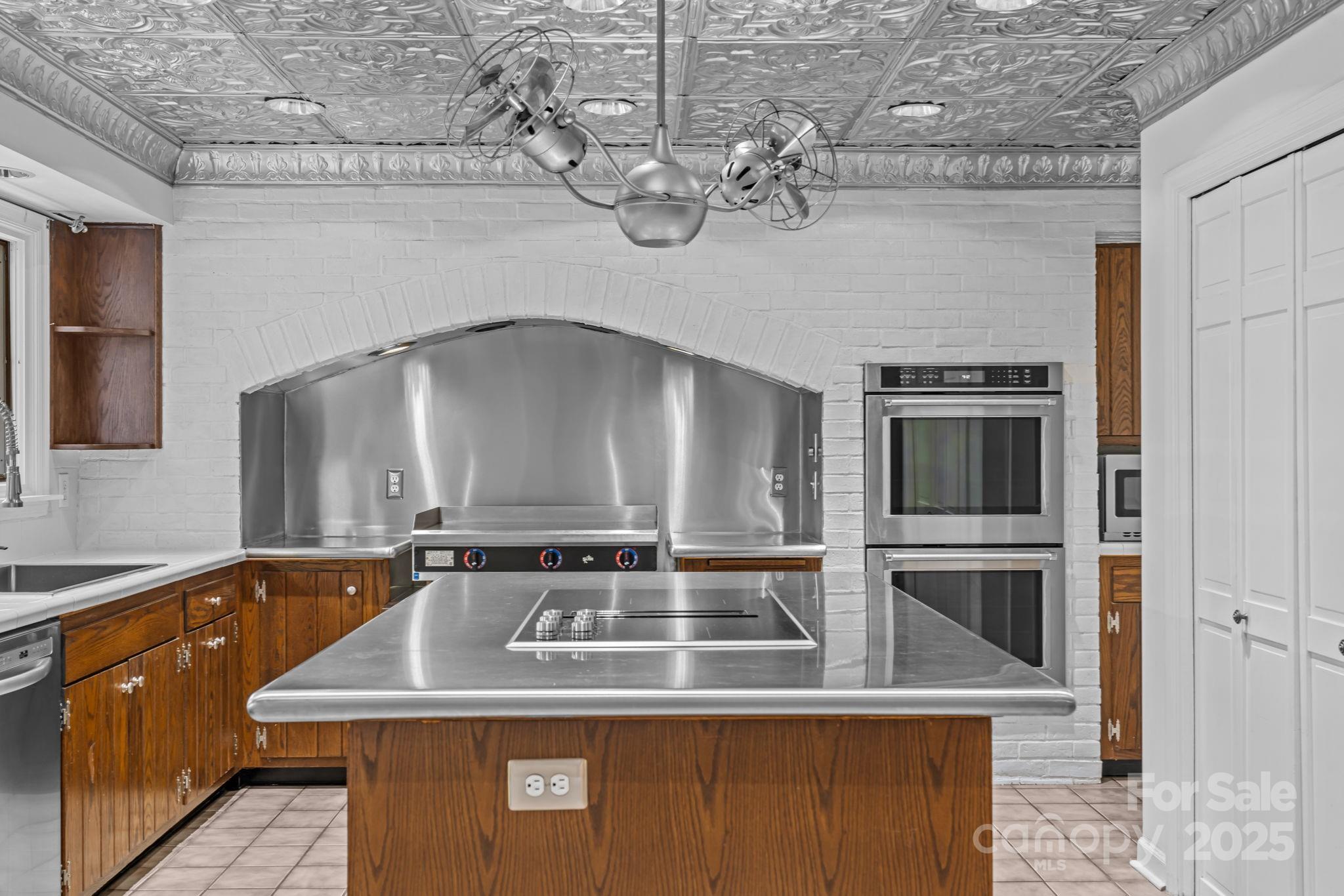 2000 Airport Road Carthage, NC 28327 - Photo 36 of 45 a view of a kitchen with a sink and stainless steel appliances
