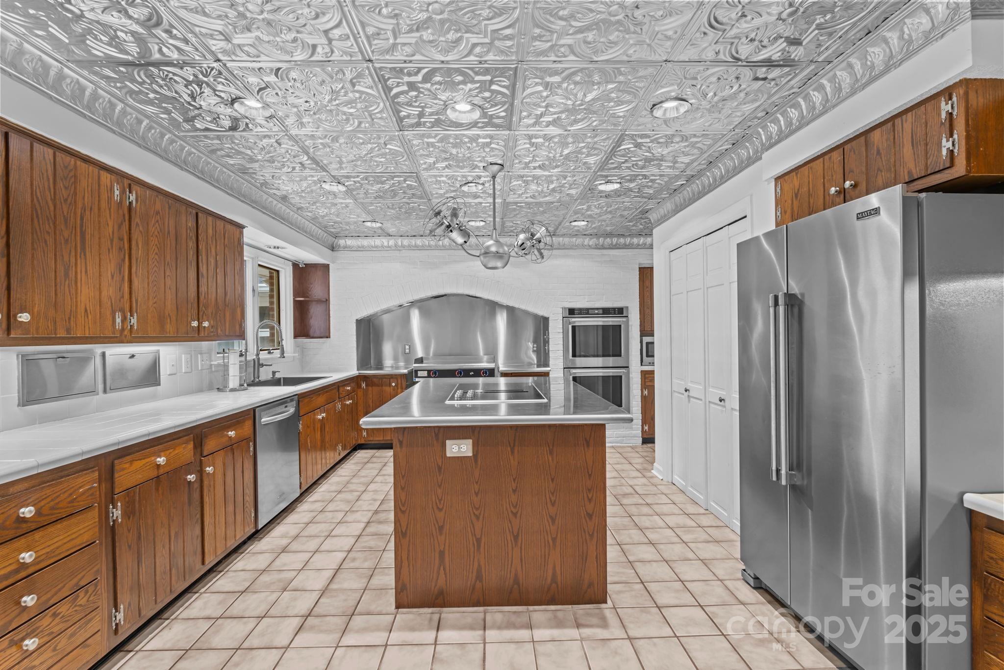 2000 Airport Road Carthage, NC 28327 - Photo 37 of 45 a large kitchen with stainless steel appliances granite countertop a sink a counter space and cabinets