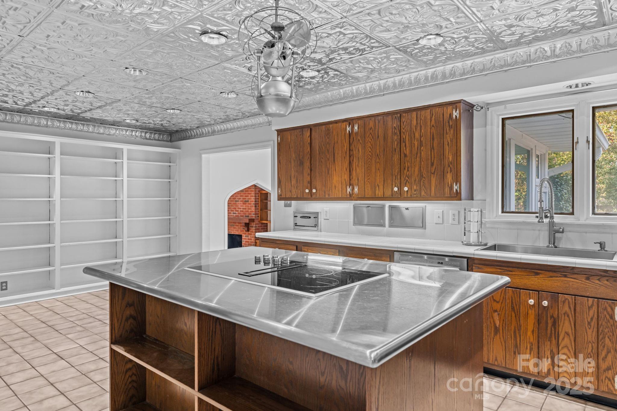 2000 Airport Road Carthage, NC 28327 - Photo 40 of 45 a kitchen with a sink and a stove top oven
