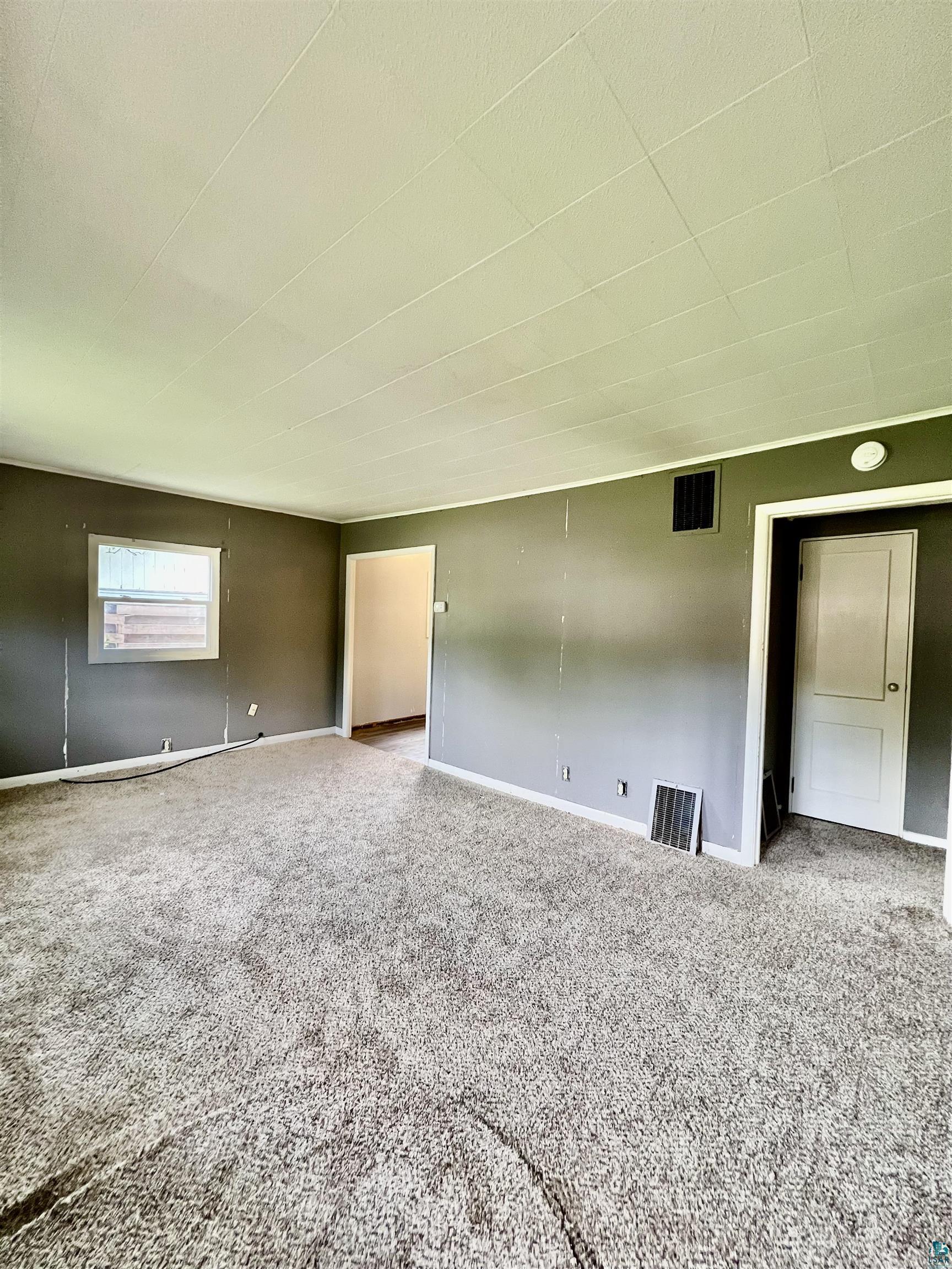 920 West Arrowhead Road Duluth, MN 55811 - Photo 3 of 16 Empty room featuring carpet floors