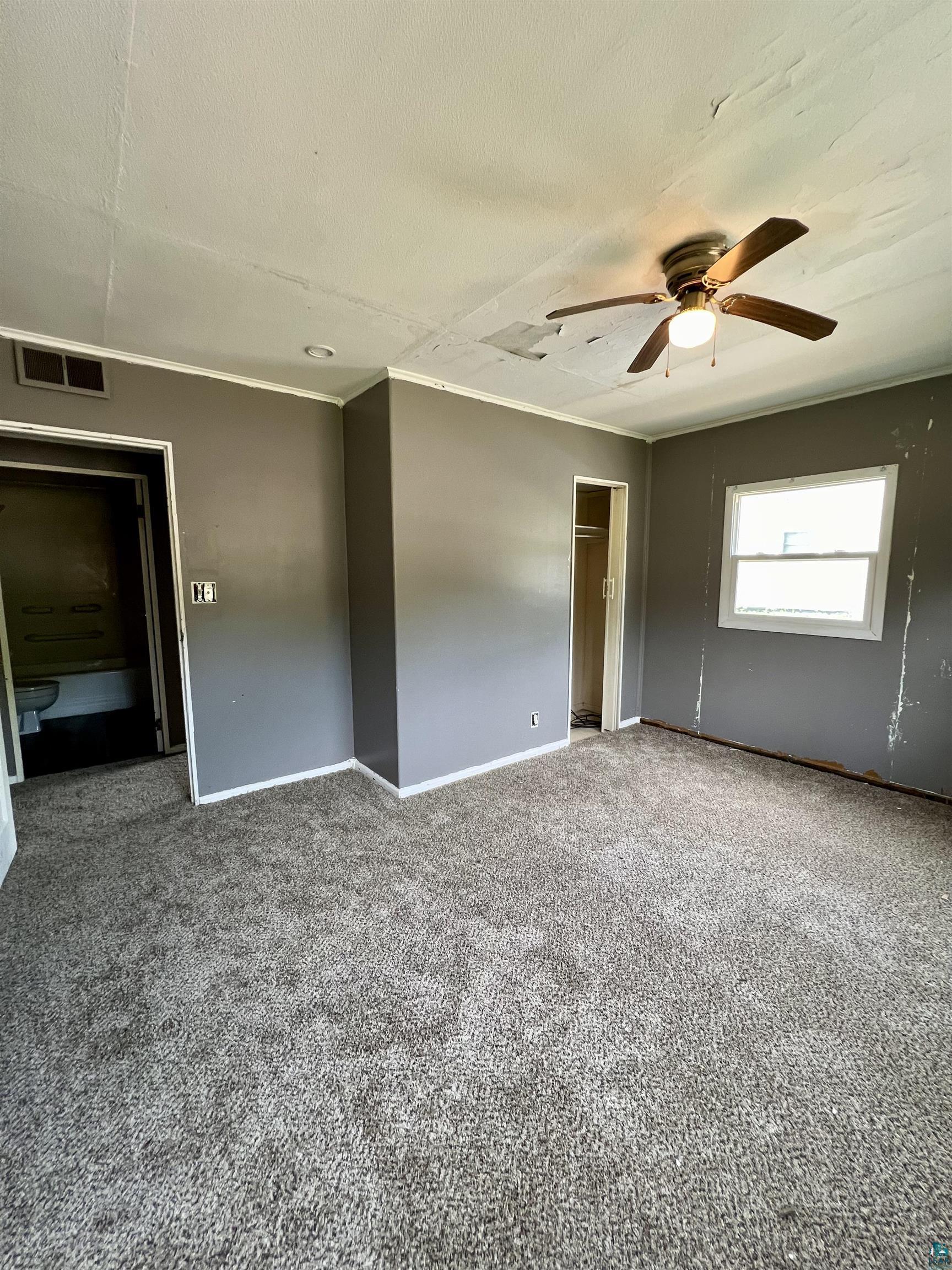 920 West Arrowhead Road Duluth, MN 55811 - Photo 8 of 16 Carpeted empty room featuring a textured ceiling and ceiling fan