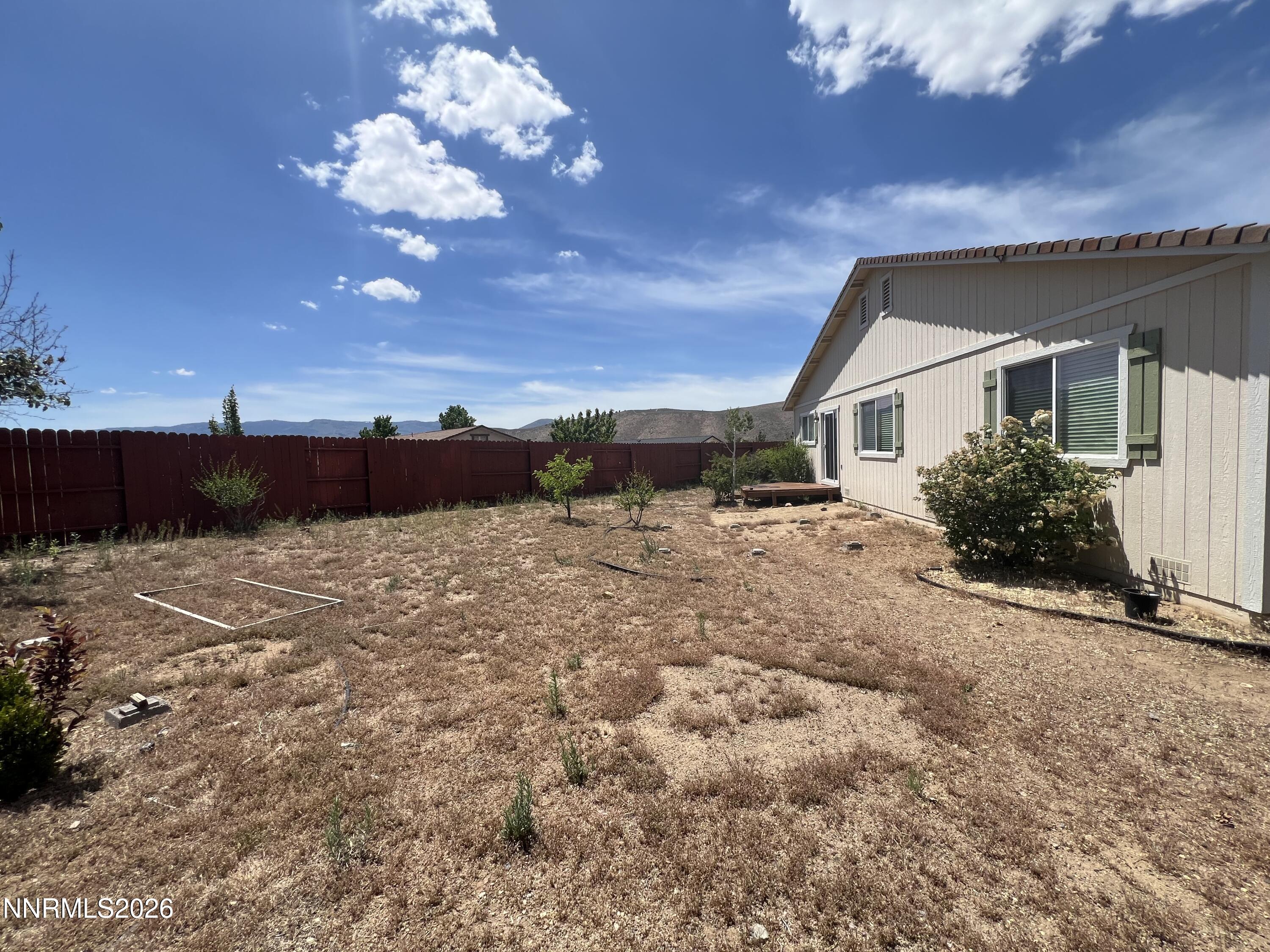 18406 Teddy Bear Court Reno, NV 89508 - Photo 37 of 44 a front view of a house with a yard