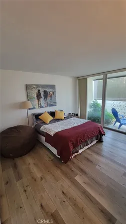 a wooden bench sitting in a room next to a window