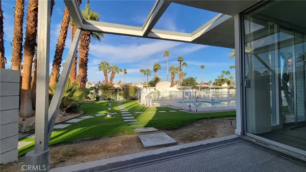 a view of a street with a garage