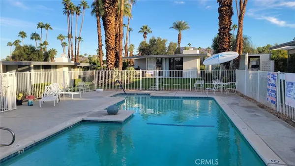 a view of a swimming pool with a patio