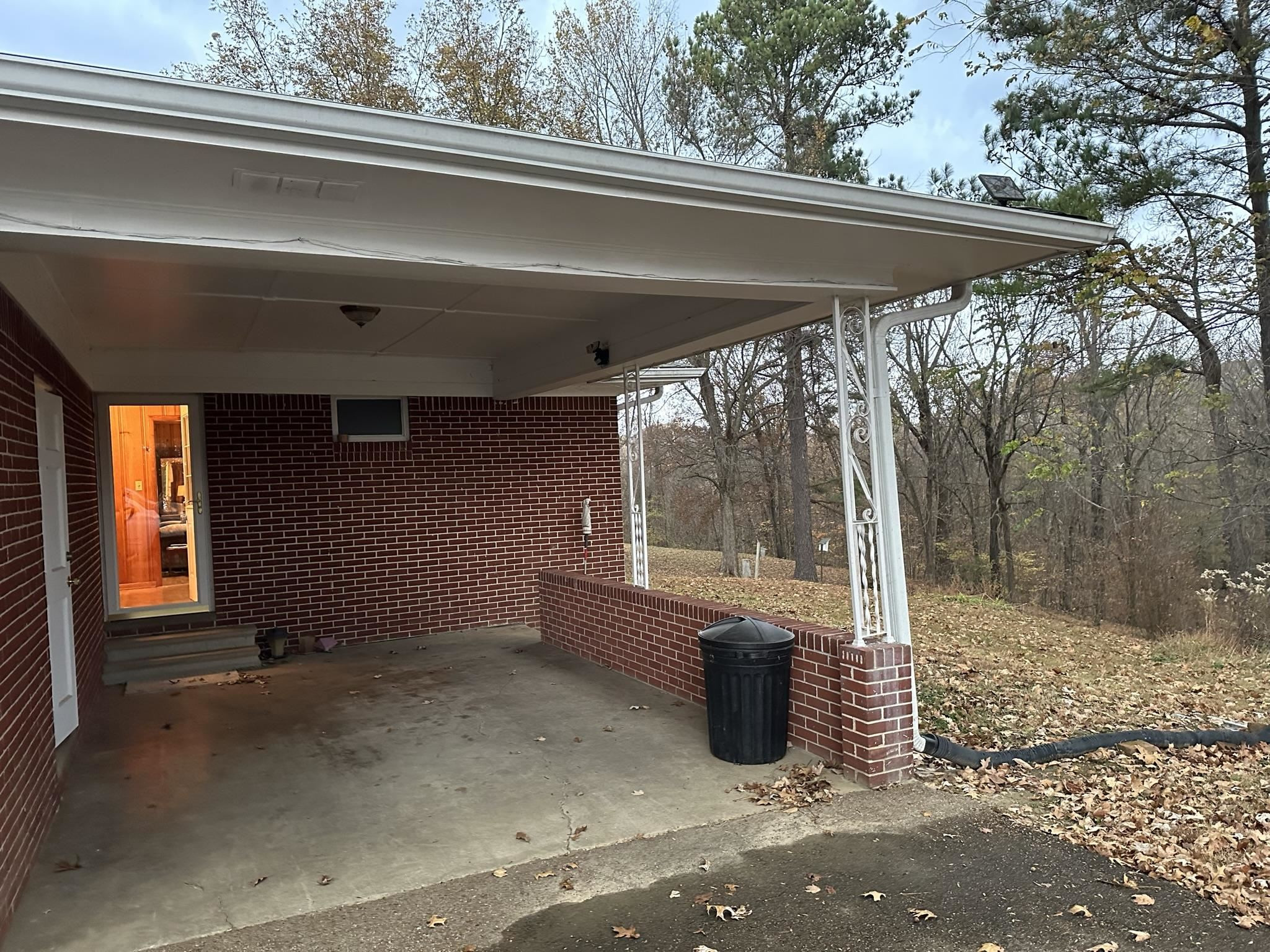 1036 Mill Creek Road Troy, TN 38260 - Photo 13 of 17 a view of a porch with furniture and floor to ceiling window