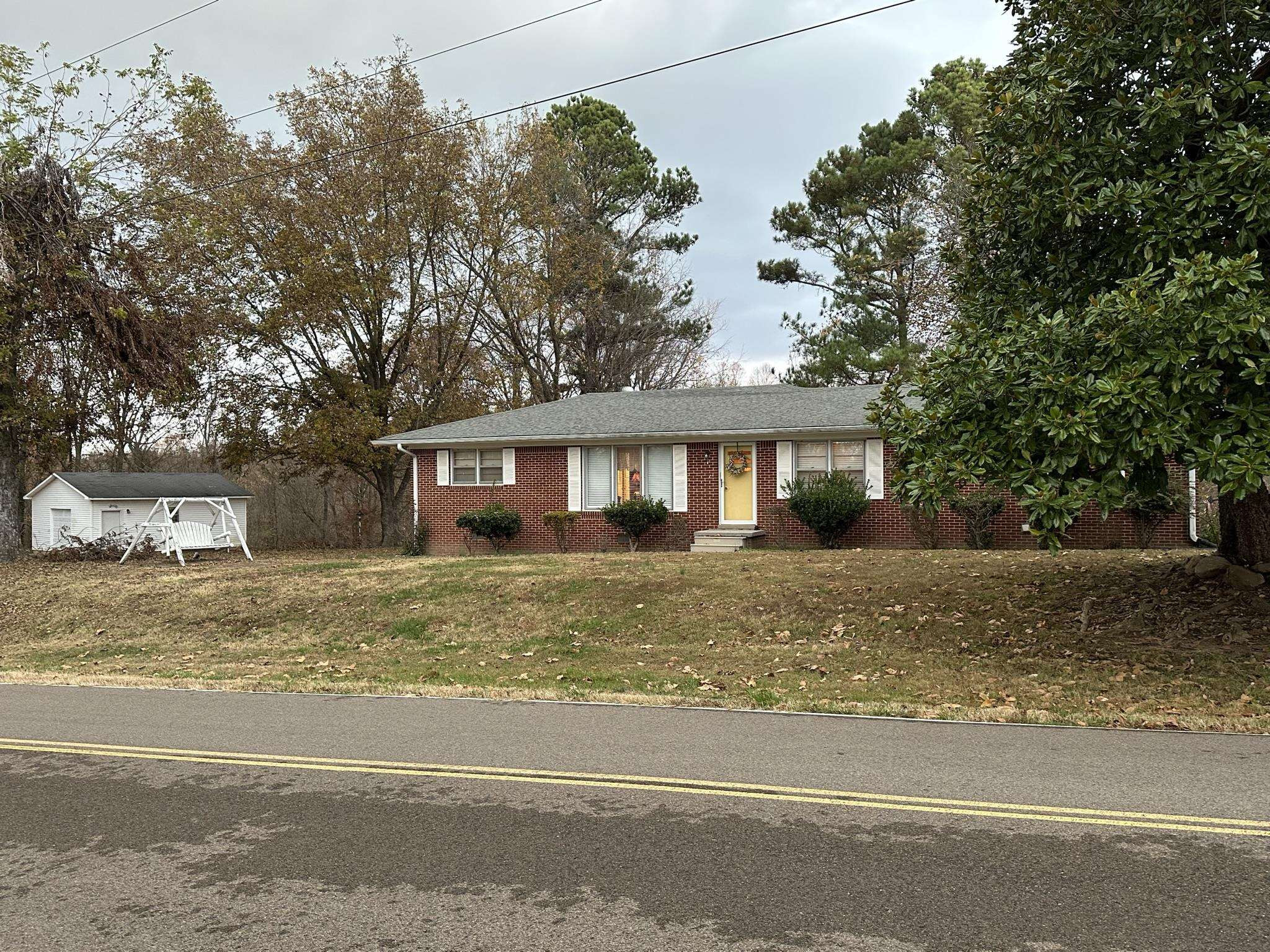 1036 Mill Creek Road Troy, TN 38260 - Photo 14 of 17 a view of a house with a yard