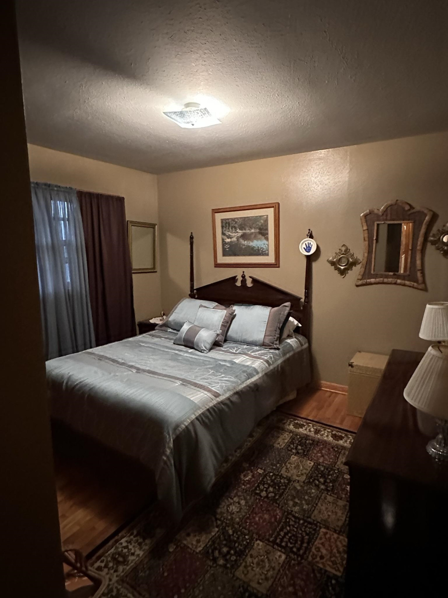 1036 Mill Creek Road Troy, TN 38260 - Photo 4 of 17 a bed sitting in a bedroom next to a window