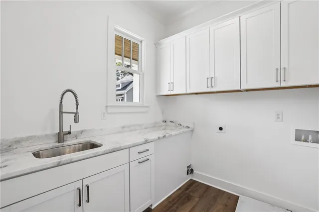 a bedroom with furniture and a flat screen tv