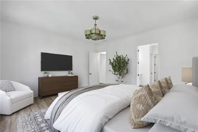 a white bath tub sitting in a bathroom next to a window