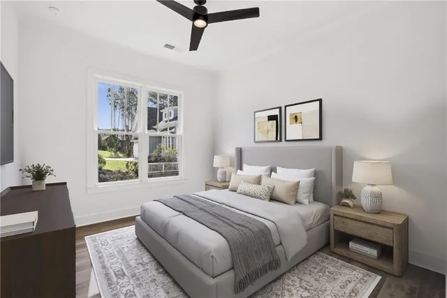 a view of a hallway with wooden floor and entryway