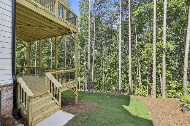 a view of a park with bench and trees