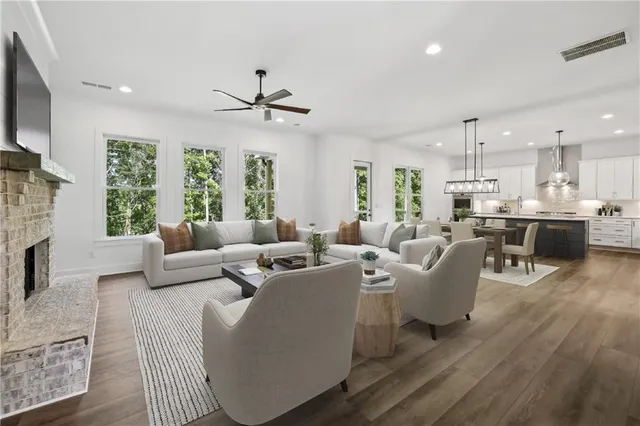 a living room with fireplace furniture and a flat screen tv