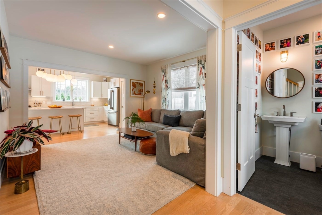 5 John West Road Exeter, NH 03833 - Photo 11 of 33 a living room with furniture a fireplace and a large window