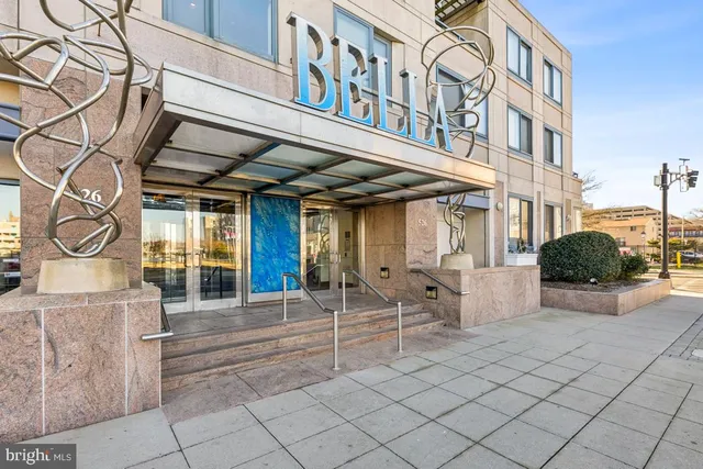 a view of a building with sitting area