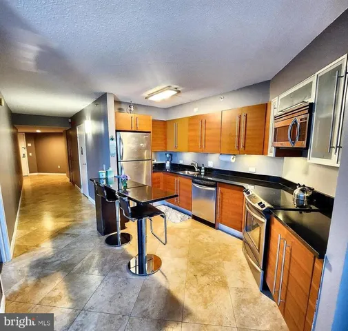 a kitchen with lots of counter top space and appliances