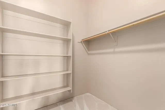 a view of an empty walk in closet