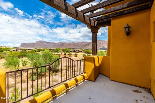 a view of balcony with furniture