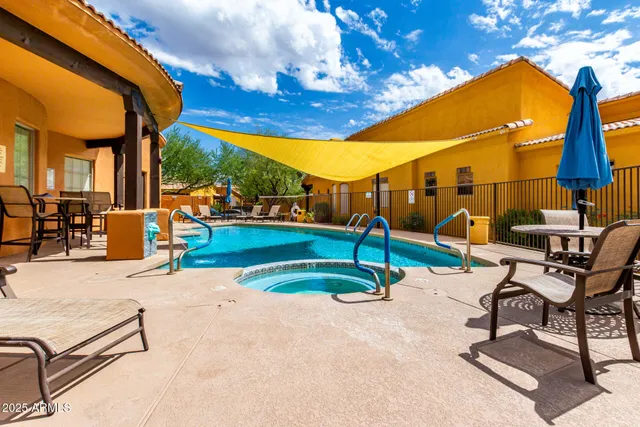 a view of a swimming pool with a lounge chairs