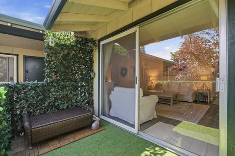 a view of backyard with a garden and entertaining space