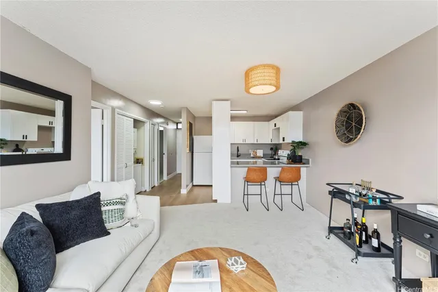 a living room with furniture and a clock