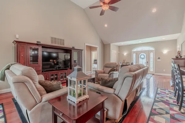 a living room with furniture and a flat screen tv