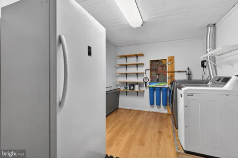 a room with appliances and cabinets
