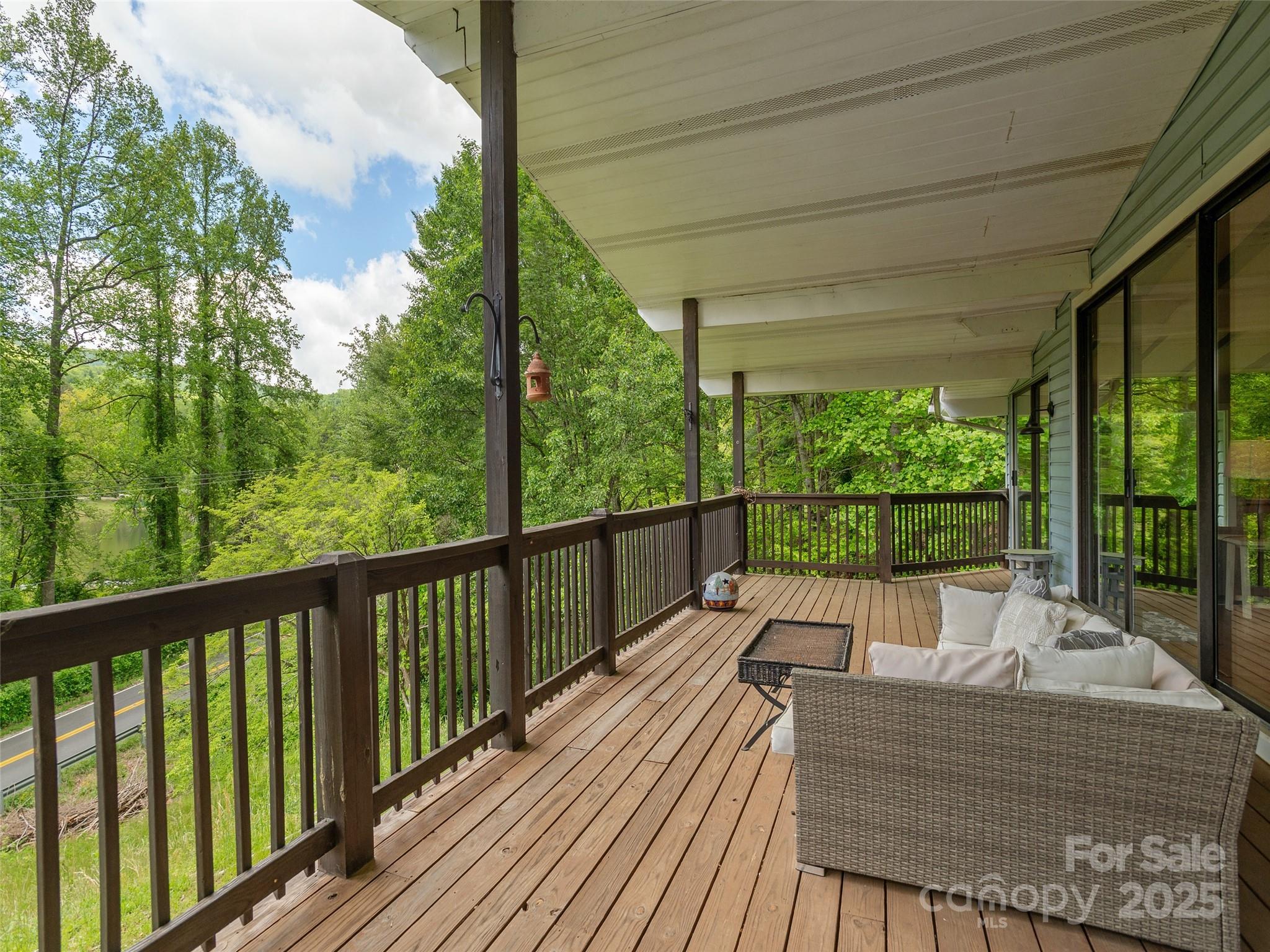 61 West Lake View Road Hendersonville, NC 28739 - Photo 12 of 37 a view of balcony with wooden floor and outdoor seating