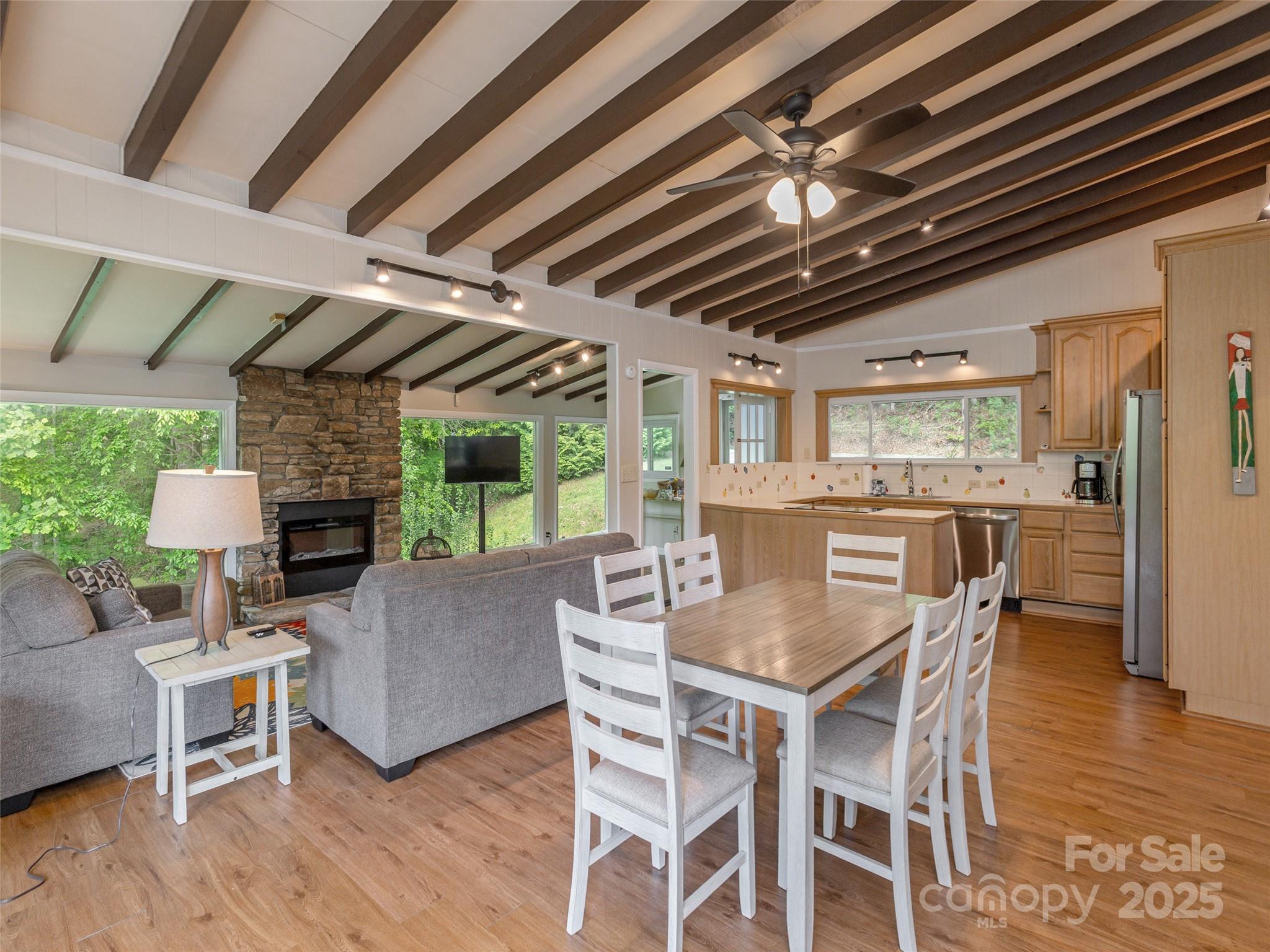 61 West Lake View Road Hendersonville, NC 28739 - Photo 13 of 37 a view of a dining room with furniture window and wooden floor