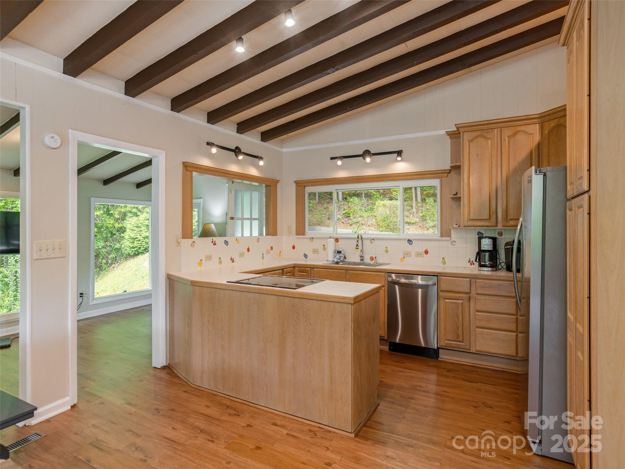61 West Lake View Road Hendersonville, NC 28739 - Photo 15 of 37 a kitchen with stainless steel appliances granite countertop a sink stove and refrigerator