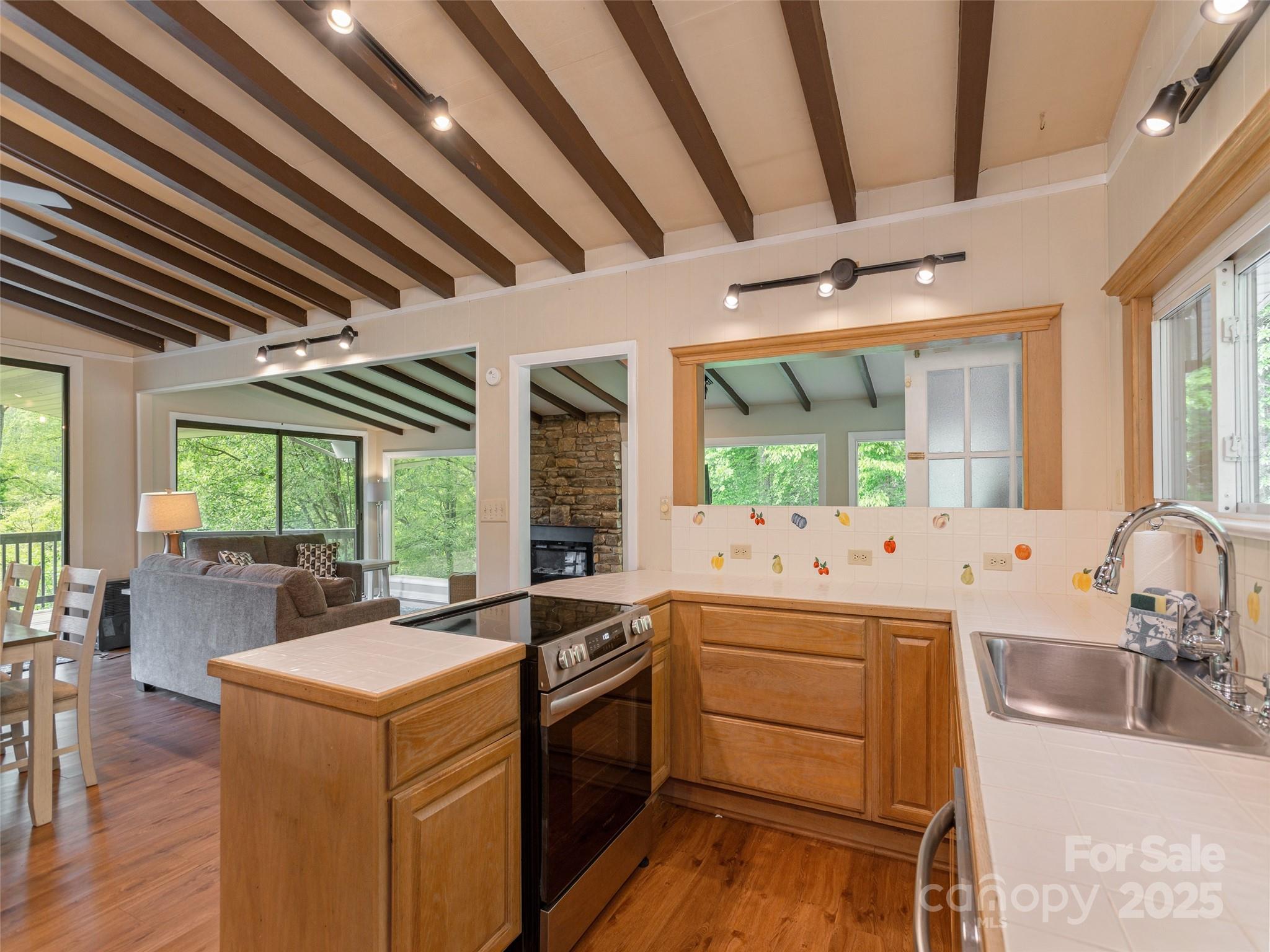 61 West Lake View Road Hendersonville, NC 28739 - Photo 17 of 37 a kitchen that has a lot of cabinets in it
