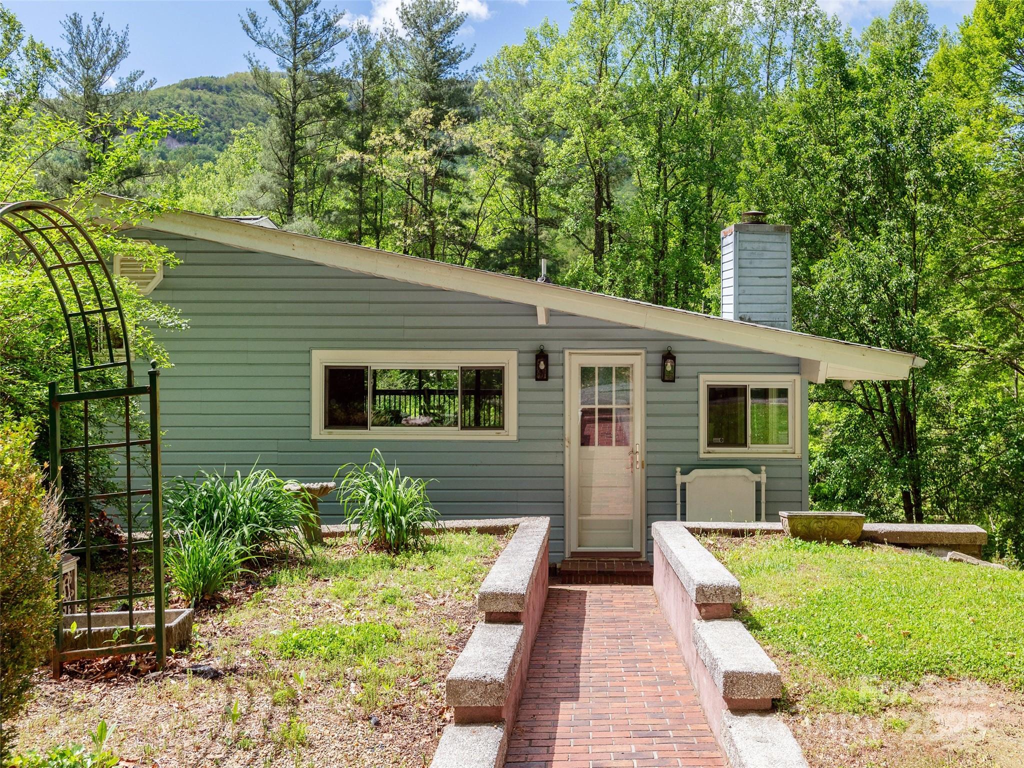 61 West Lake View Road Hendersonville, NC 28739 - Photo 3 of 37 a view of a house with a yard